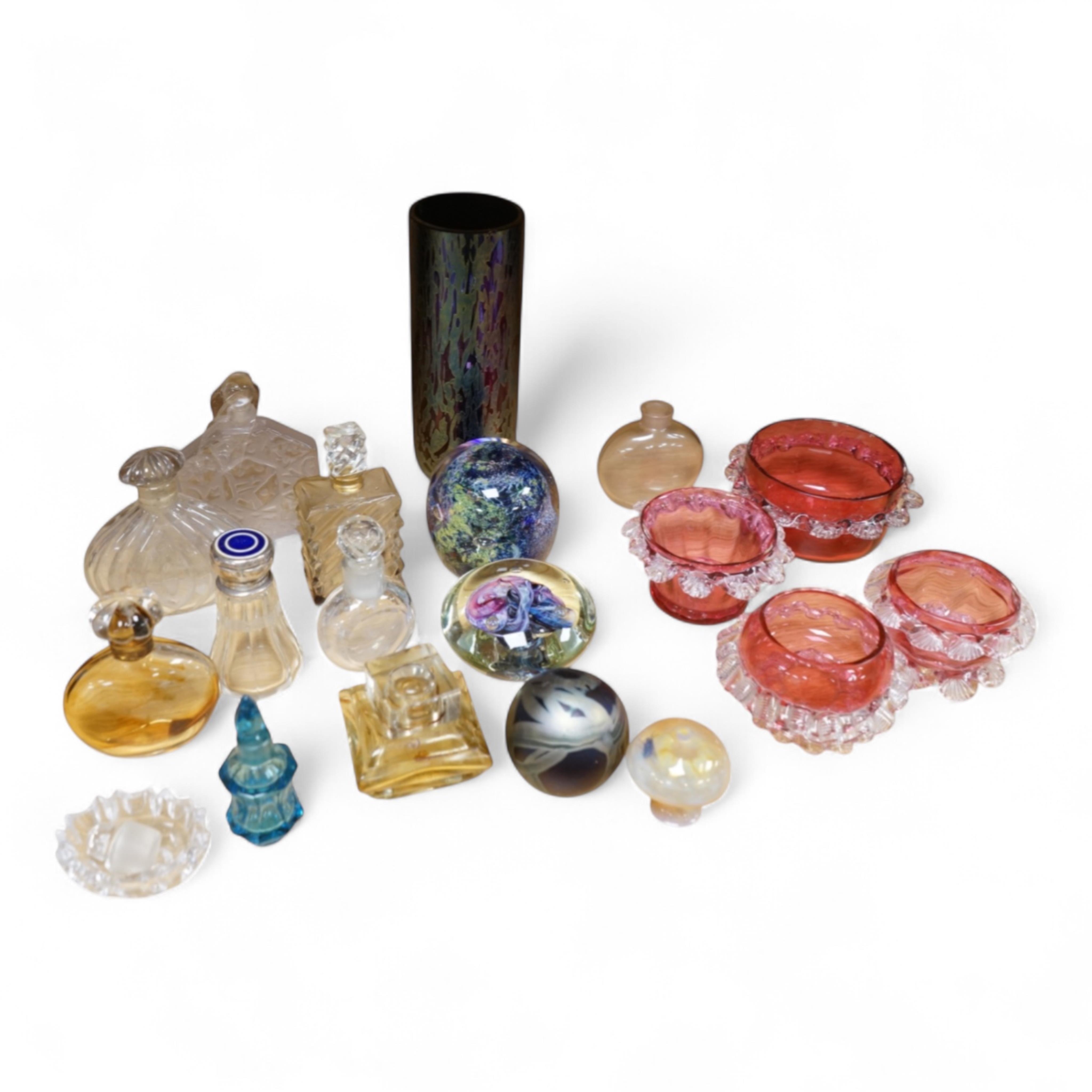 A collection of scent bottles, cranberry glass salts, three glass paperweights and a vase. tallest 18cm high